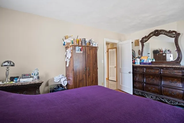 a bed room with a bed and a television