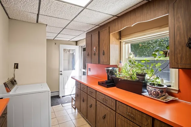 a room with sink and view of living room