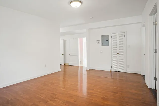 wooden floor with white walls