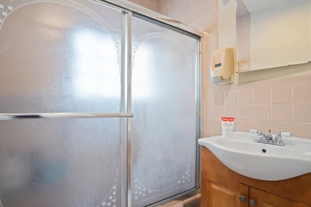 a bathroom with a sink and mirror
