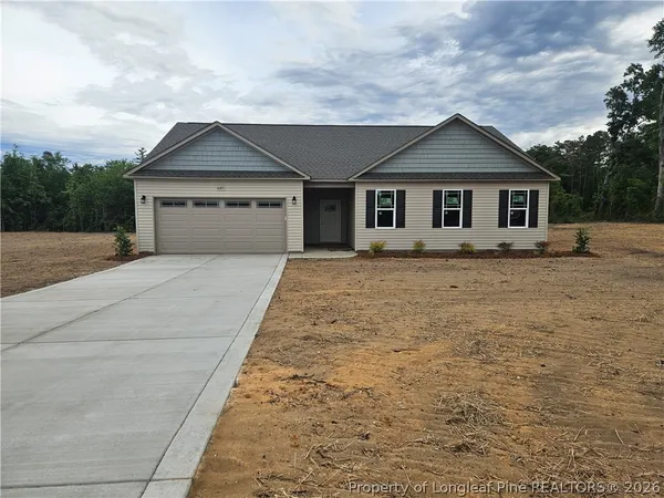 a front view of a house with yard