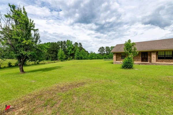 a bedroom with a bed and a view of bathroom