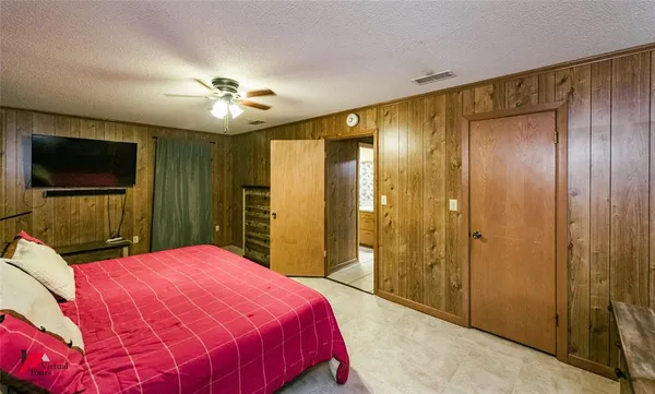 a bathroom with a sink mirror and a shower