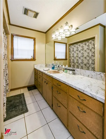 a kitchen with a stove a fridge and storage