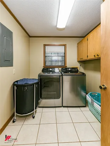 a kitchen with stainless steel appliances kitchen island granite countertop a refrigerator a sink a stove and white cabinets