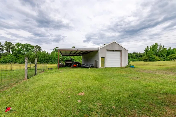 a fire hydrant in the middle of a field
