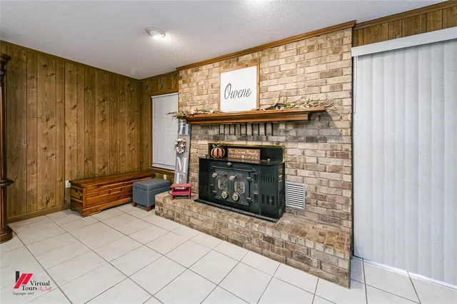 a living room with furniture and a mirror