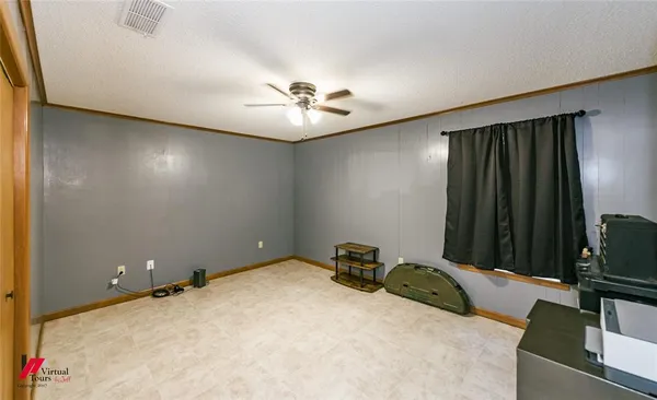 a view of room with furniture and a ceiling fan