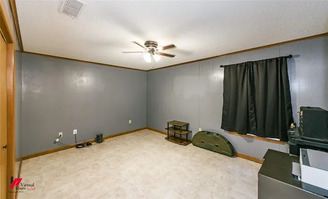 a view of room with furniture and a ceiling fan