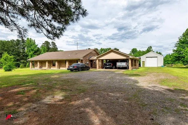 a view of a house with a big yard
