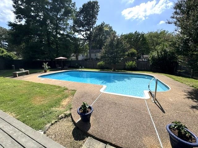 1897 Corbin Road Germantown, TN 38139 - Photo 8 of 22 Private backyard oasis featuring a freeform swimming pool with a concrete surround