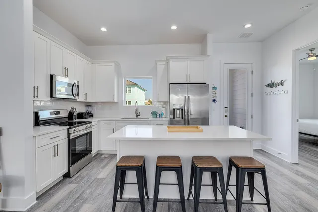 a bathroom with a shower toilet sink and mirror
