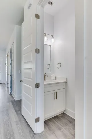 a bathroom with a sink and mirror