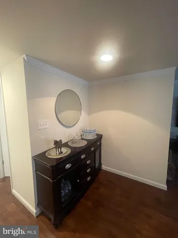 a room with a table and a mirror