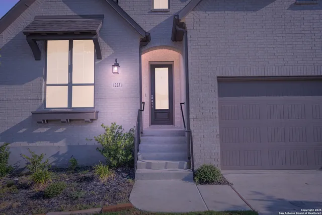 a view of a house with a backyard and porch
