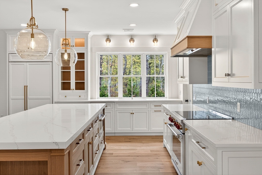 132 Great Western Road Harwich, MA 02645 - Photo 6 of 42 a kitchen with a sink stove and cabinets
