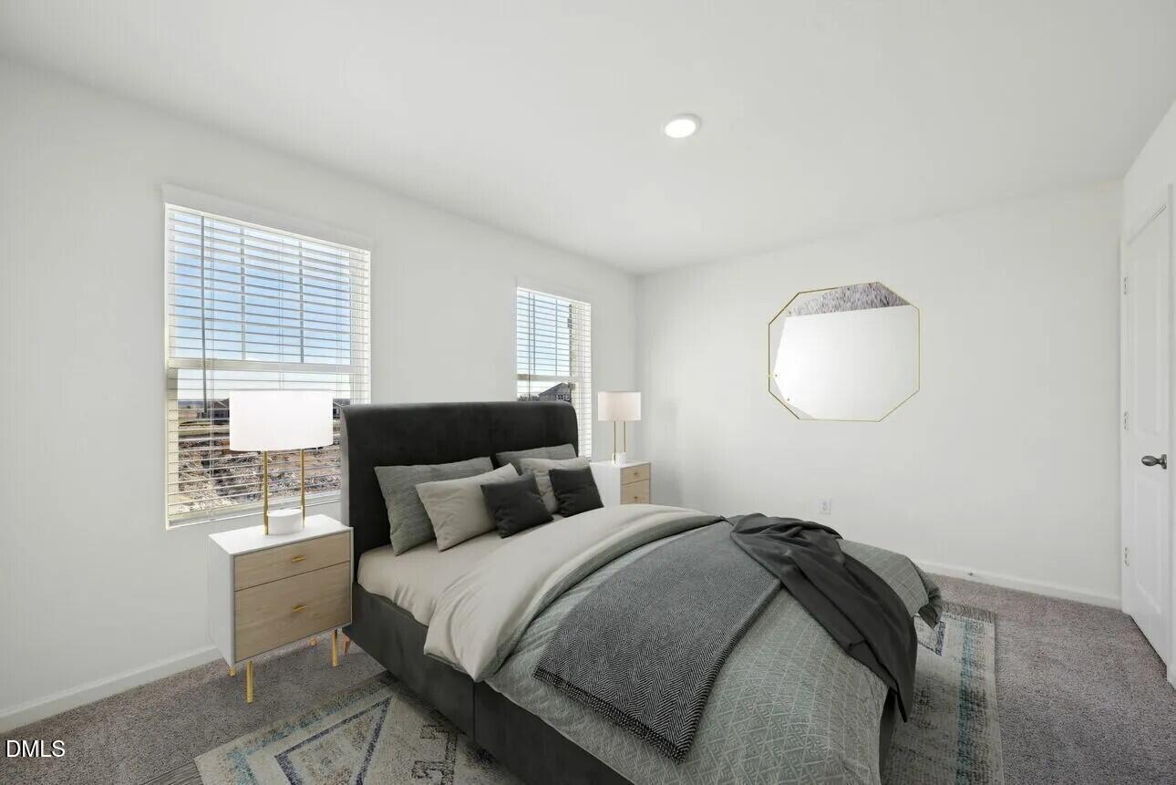 1325 Solace Way Rolesville, NC 27571 - Photo 9 of 29 a bedroom with bed and a window