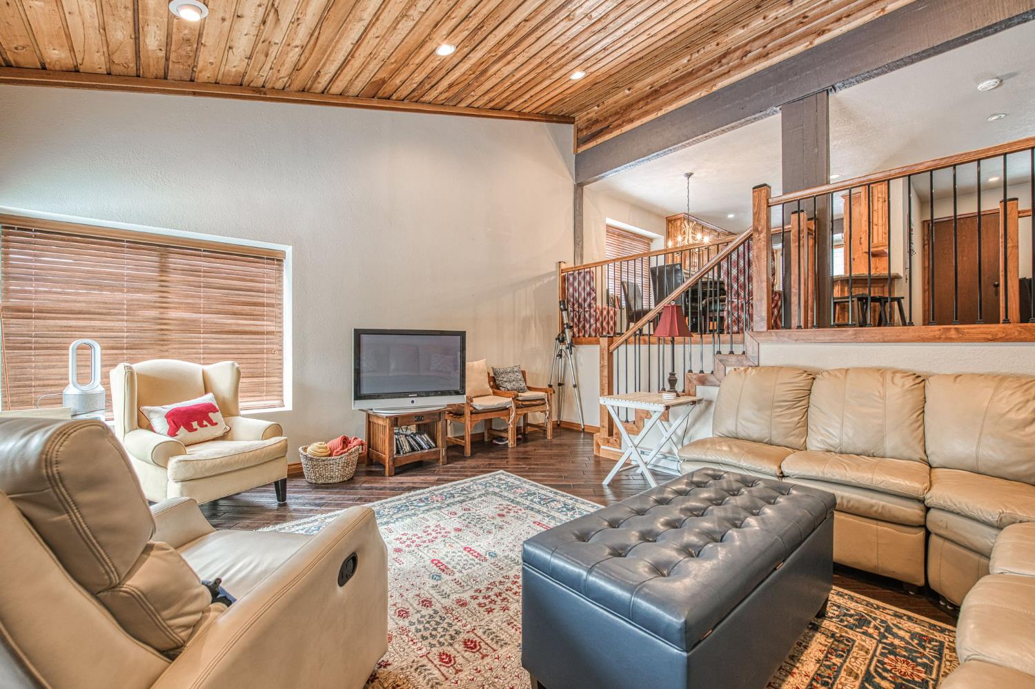 62687 Huntington Vista Road, Unit 114 Mono Hot Springs, CA 93642 - Photo 12 of 23 a living room with furniture and a flat screen tv with wooden floor