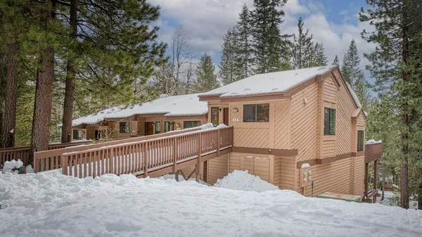 a view of a house with a yard from a balcony