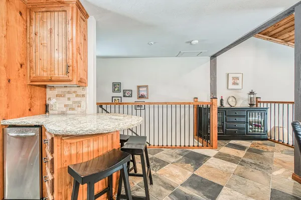 a kitchen that has a cabinets and a table in it