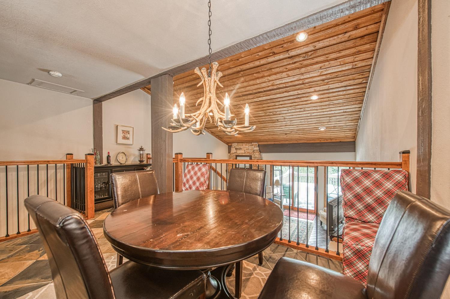 62687 Huntington Vista Road, Unit 114 Mono Hot Springs, CA 93642 - Photo 5 of 23 a dining room with furniture and wooden floor