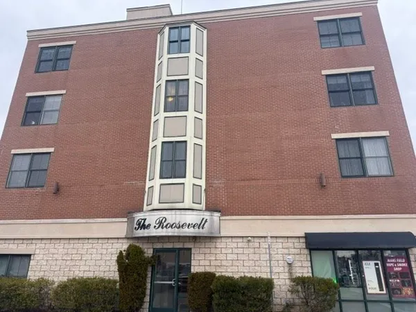 a front view of a building with a glass door