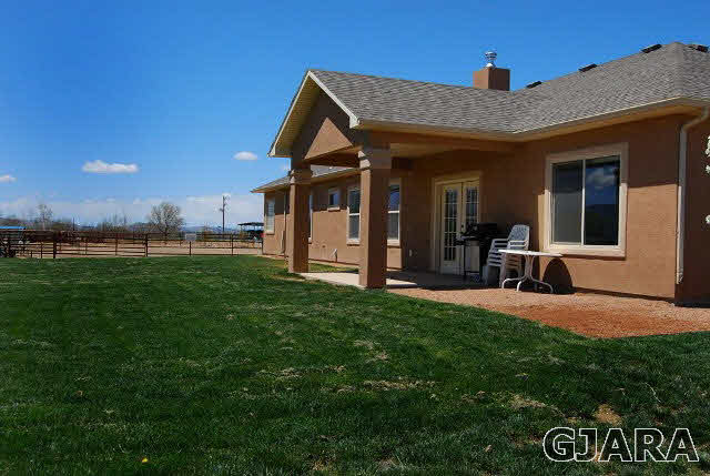 2003 Roma Avenue Fruita, CO 81521 - Photo 7 of 23 a view of a house with a yard