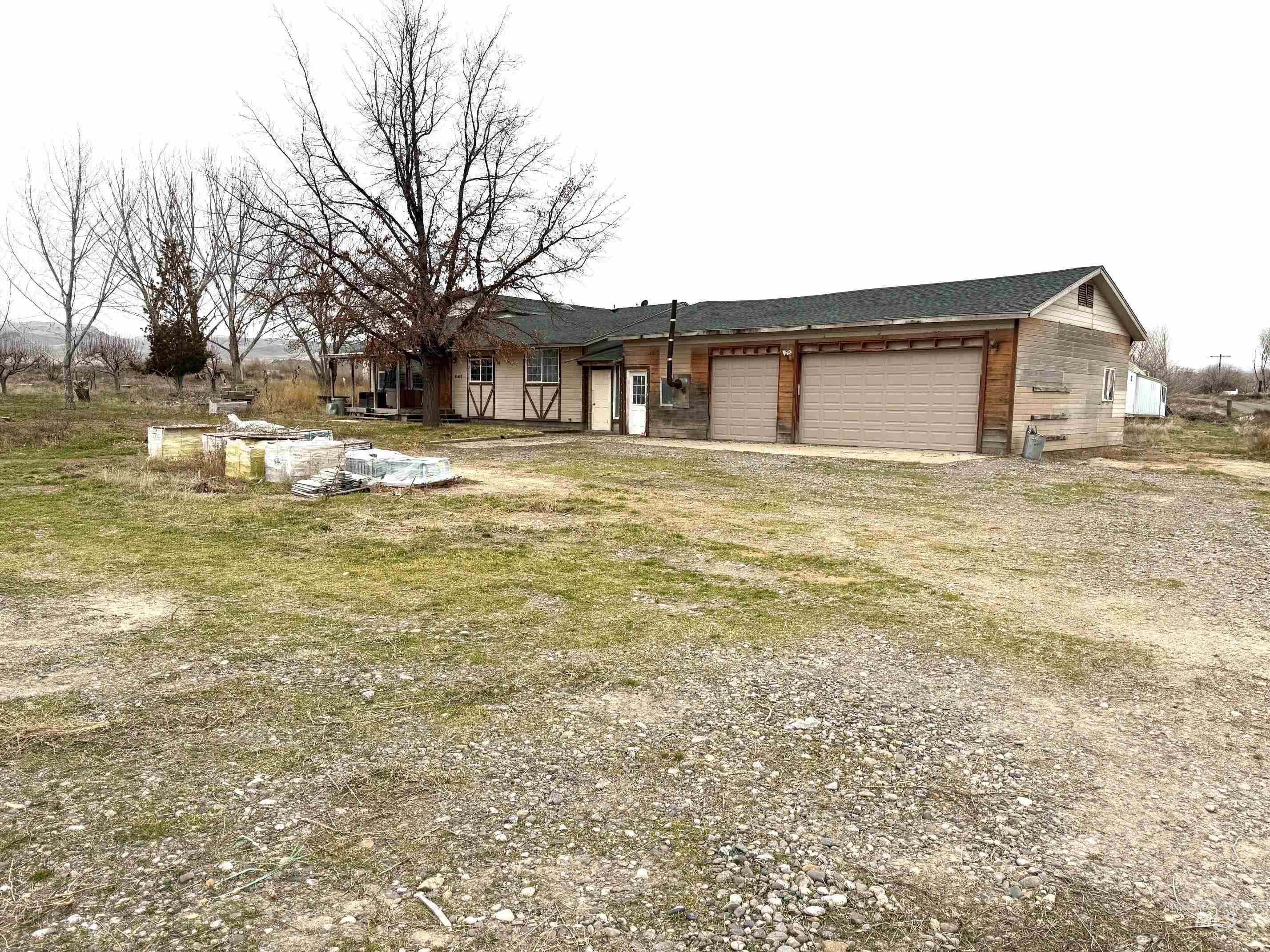 11487 Highway 78 Melba, ID 83641 - Photo 4 of 11 View of front of home featuring driveway, a garage, and a shingled roof