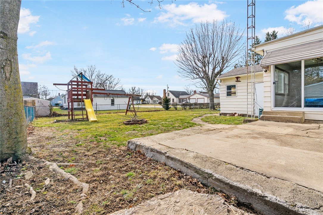 2942 17th Street Northwest Canton, OH 44708 - Photo 25 of 25 View of fenced-in yard with a patio area and a playground
