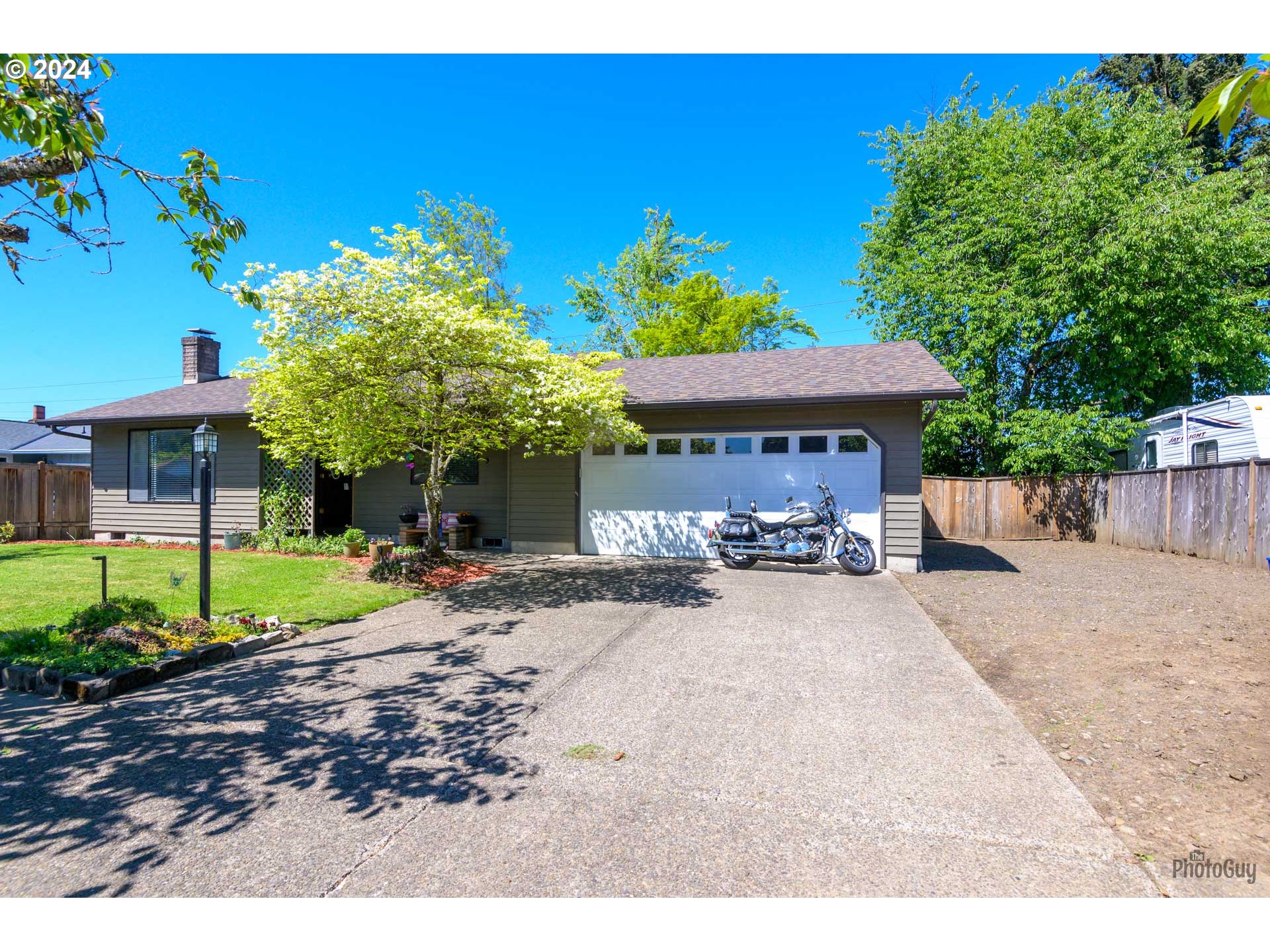666 56th Street Springfield, OR 97478 - Photo 1 of 31 a view of a house with backyard and sitting area