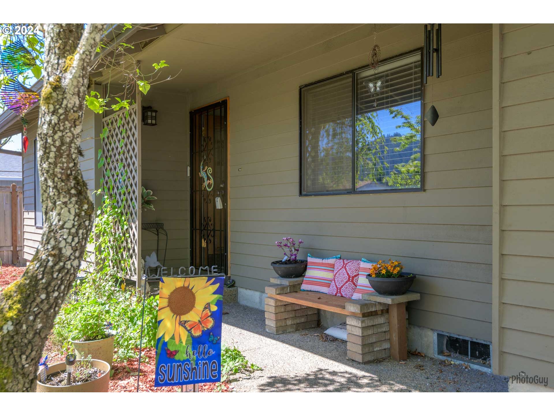 666 56th Street Springfield, OR 97478 - Photo 4 of 31 a backyard of a house with outdoor seating