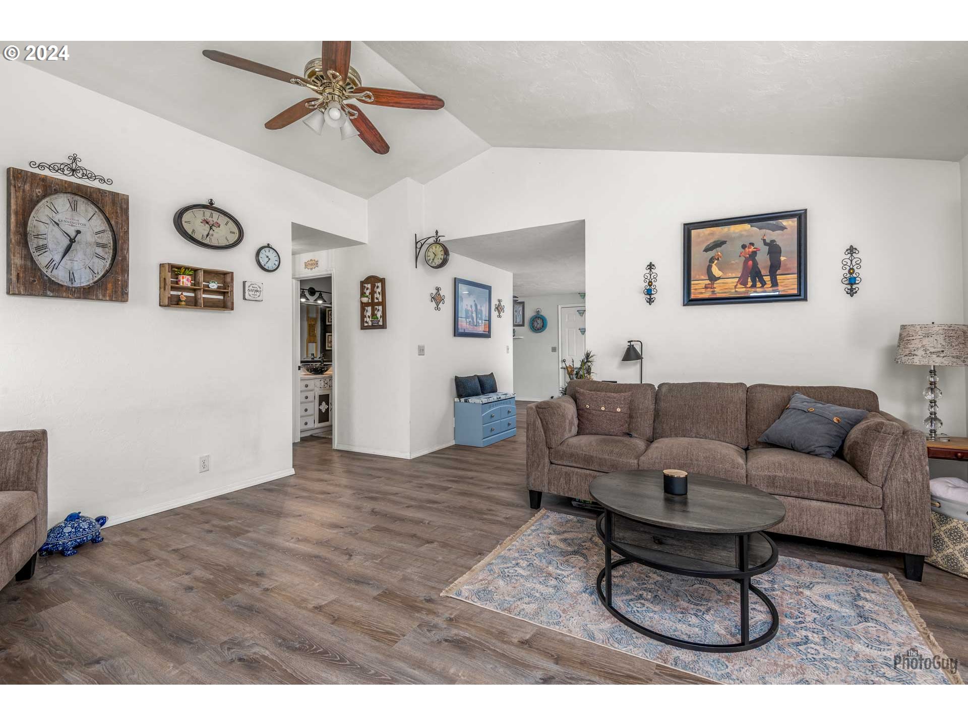 666 56th Street Springfield, OR 97478 - Photo 9 of 31 a living room with furniture and a dining table with wooden floor