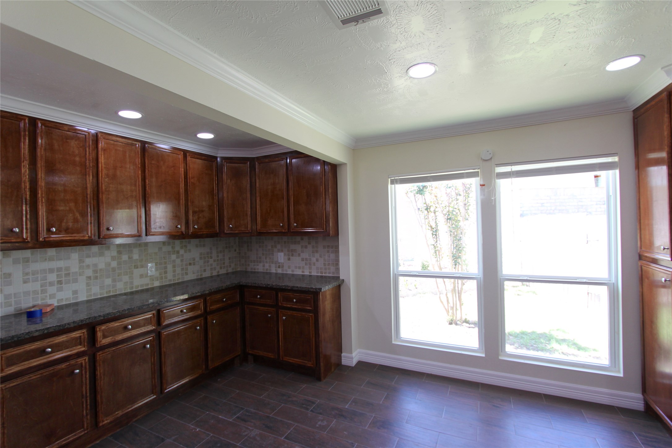 4330 Regency Villa Drive Houston, TX 77084 - Photo 3 of 13 a kitchen with granite countertop a stove a sink and a cabinets