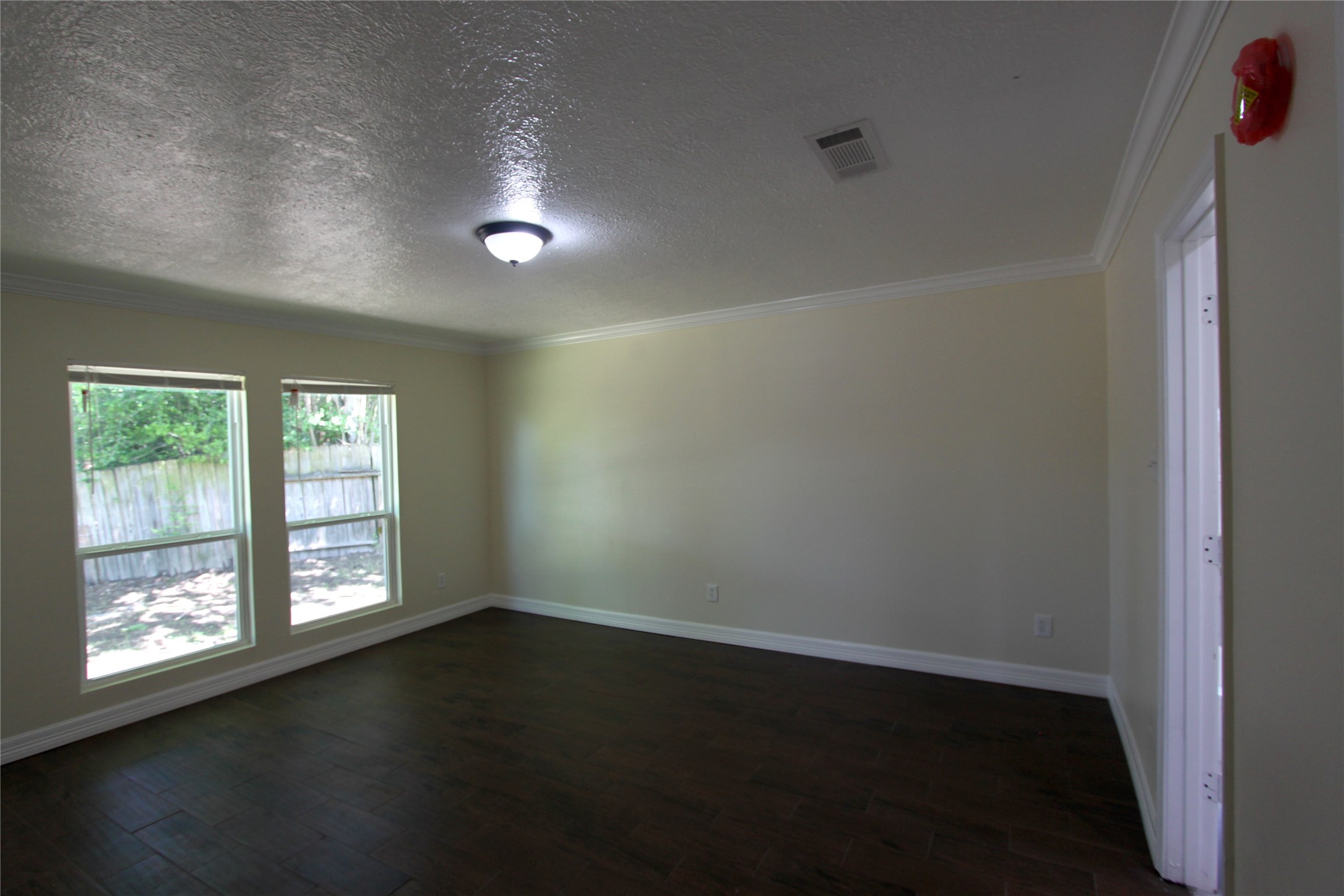 4330 Regency Villa Drive Houston, TX 77084 - Photo 6 of 13 an empty room with wooden floor and windows