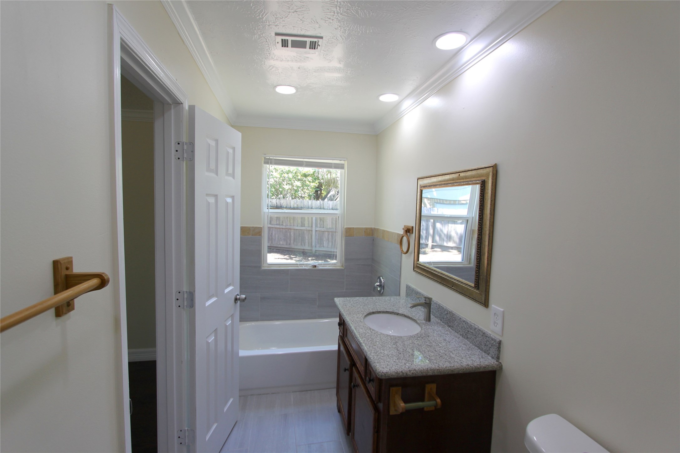 4330 Regency Villa Drive Houston, TX 77084 - Photo 9 of 13 a bathroom with a granite countertop sink a toilet and shower