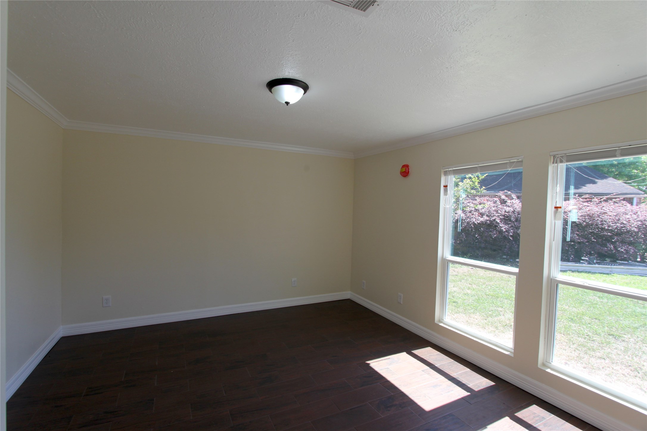 4330 Regency Villa Drive Houston, TX 77084 - Photo 10 of 13 an empty room with wooden floor and windows