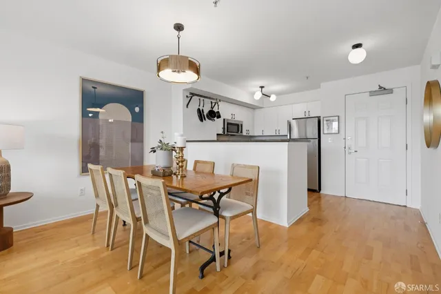 a view of a dining room with furniture and wooden floor