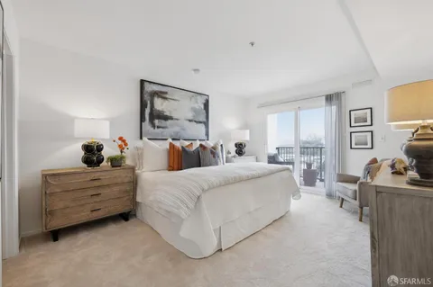 a bed room with bed and window