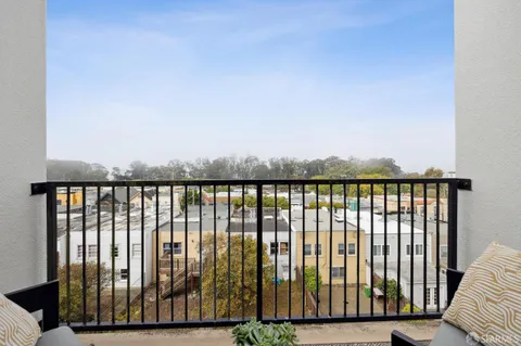 a view of balcony with wooden floor