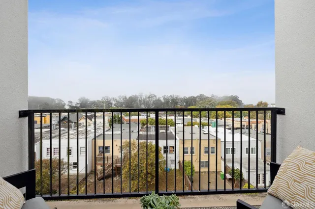 a view of balcony with wooden floor
