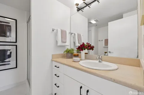 a bathroom with a sink and a mirror