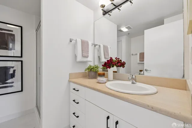 a bathroom with a sink and a mirror