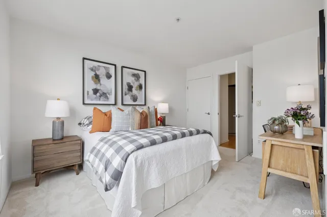 a bedroom with a bed and a chair