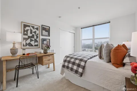 a bedroom with furniture and windows