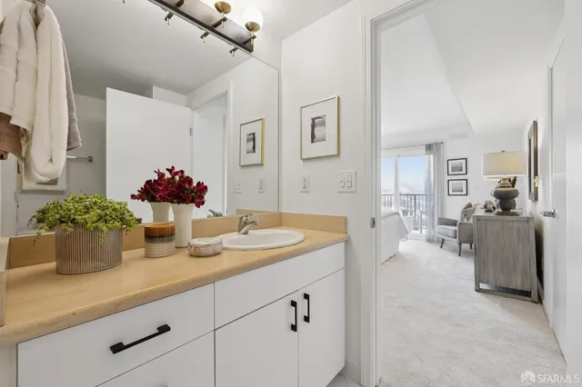 a bathroom with sink and mirror