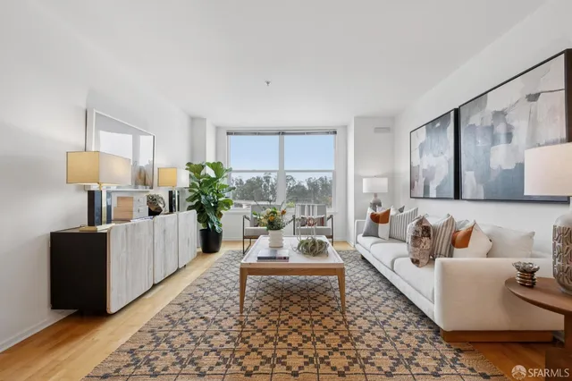 a living room with furniture and a lamp