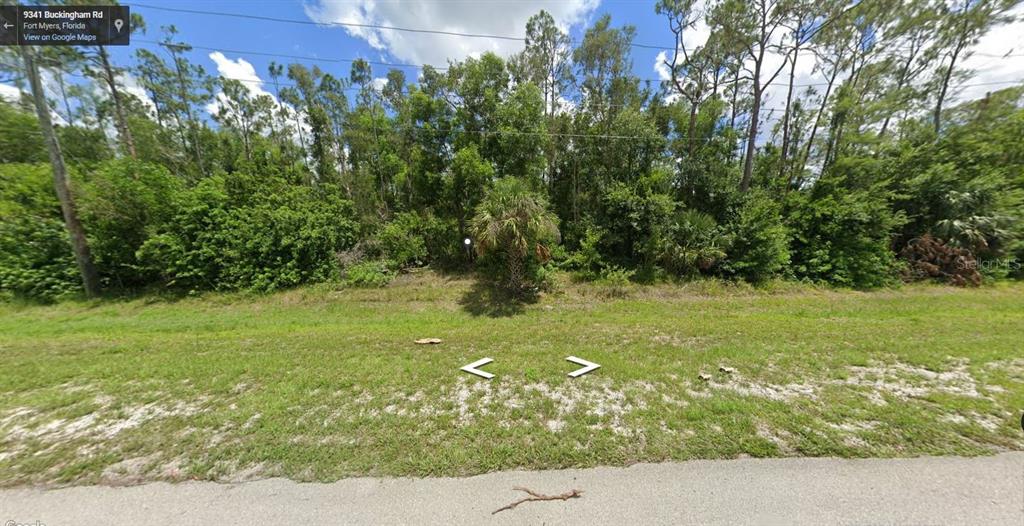 9341 Buckingham Road Lehigh Acres, FL 33971 - Photo 1 of 1 a view of yard with green space