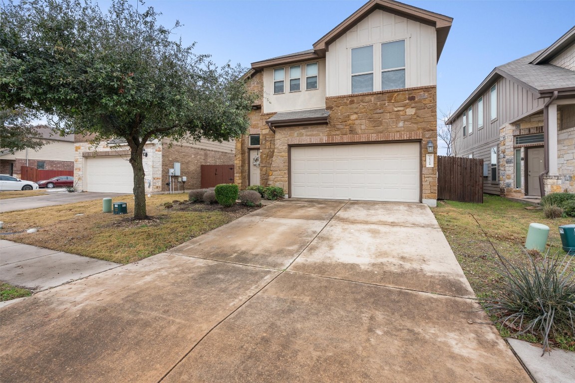 16304 Travesia Way Austin, TX 78728 - Photo 1 of 1 a front view of a house with a yard and garage