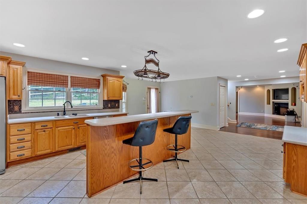 2 Stonebrook Drive Rome, GA 30165 - Photo 14 of 44 a kitchen with stainless steel appliances granite countertop a sink and a large window