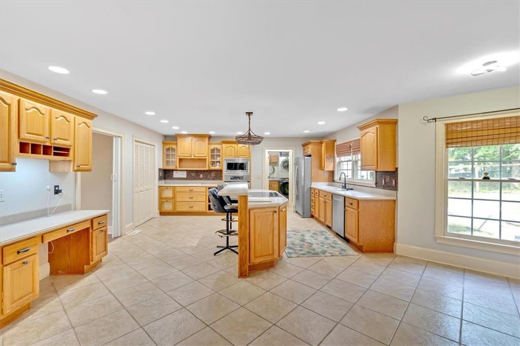 2 Stonebrook Drive Rome, GA 30165 - Photo 15 of 44 a kitchen with stainless steel appliances granite countertop a refrigerator and a sink